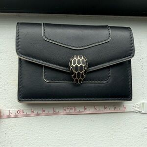 Bulgari Black Leather Card Wallet with Gold Logo has some small scratches